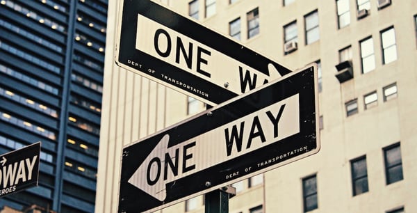 One ways signs pointing in different directions